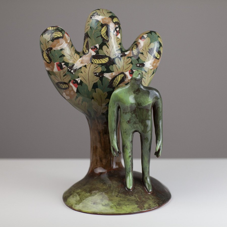Man watching a charm of goldfinches by Jenny Southam